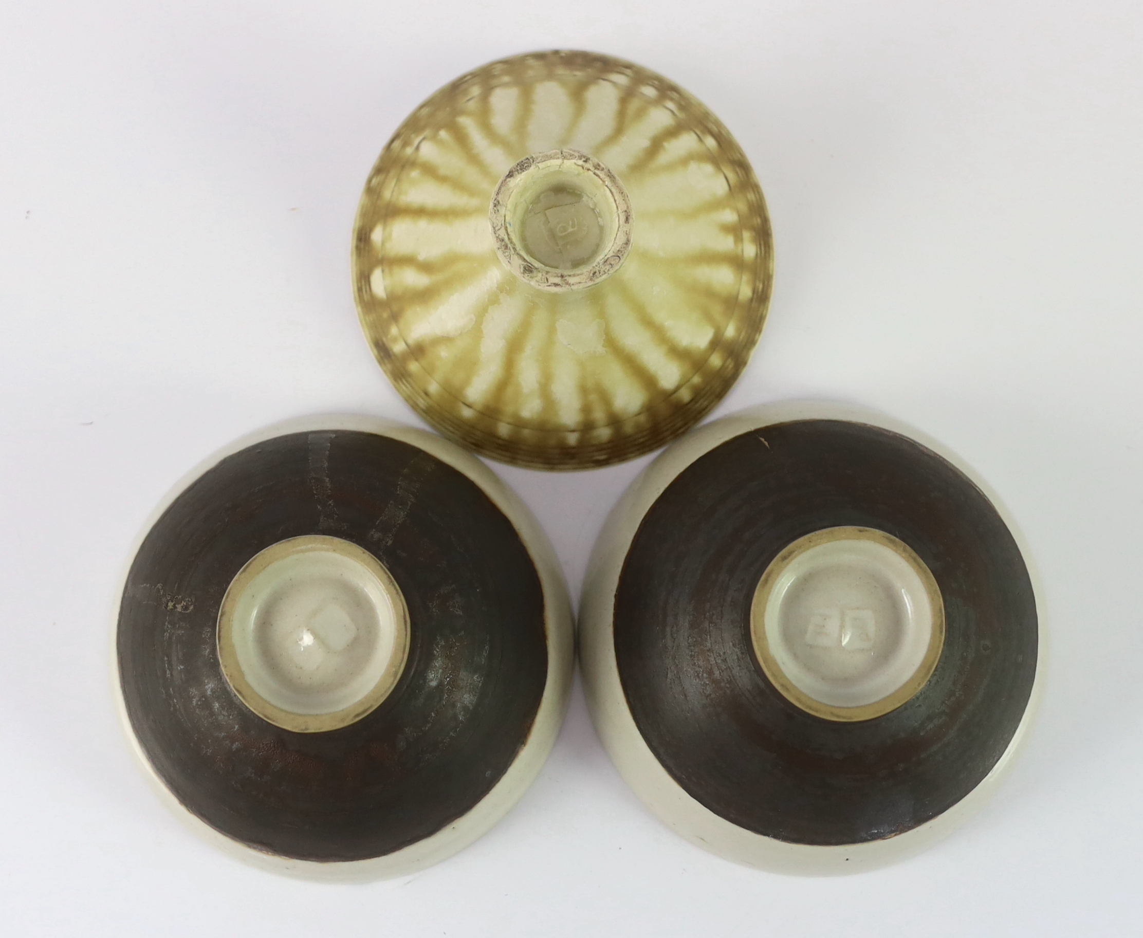 Dame Lucie Rie D.B.E. (1902-1995) and Hans Coper (1920-1981), a pair of stoneware bowls and a third stoneware bowl by Dame Lucie Rie